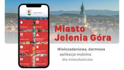 Plansza reklamująca aplikację miejską.